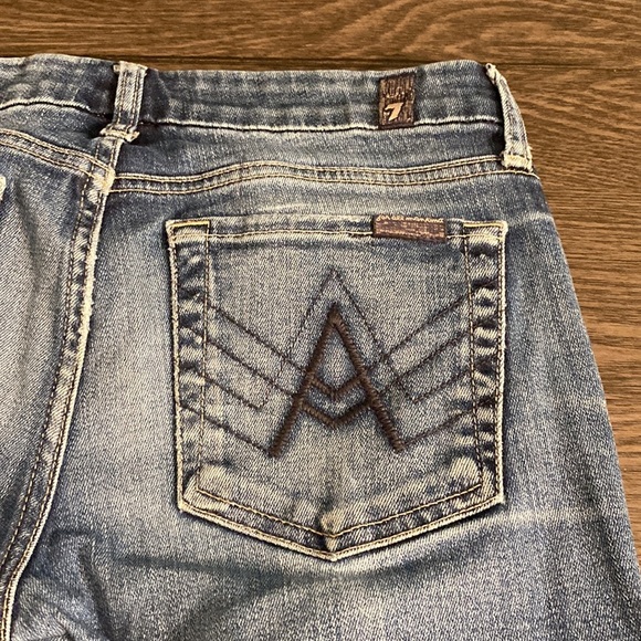 7 for all mankind boot cut flare jeans. Size 27. Medium wash. Faded front. - Picture 11 of 16